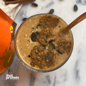 
                  
                    Load image into Gallery viewer, that protein I Heart Pumpkin and Chia Seed Super Protein served as a high protein smoothie in a glass sprinkled with cinnamon and pumpkin seeds
                  
                